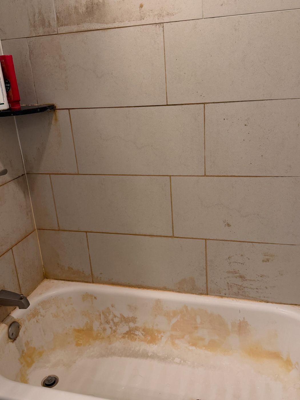 bathtub and tile, before cleaning