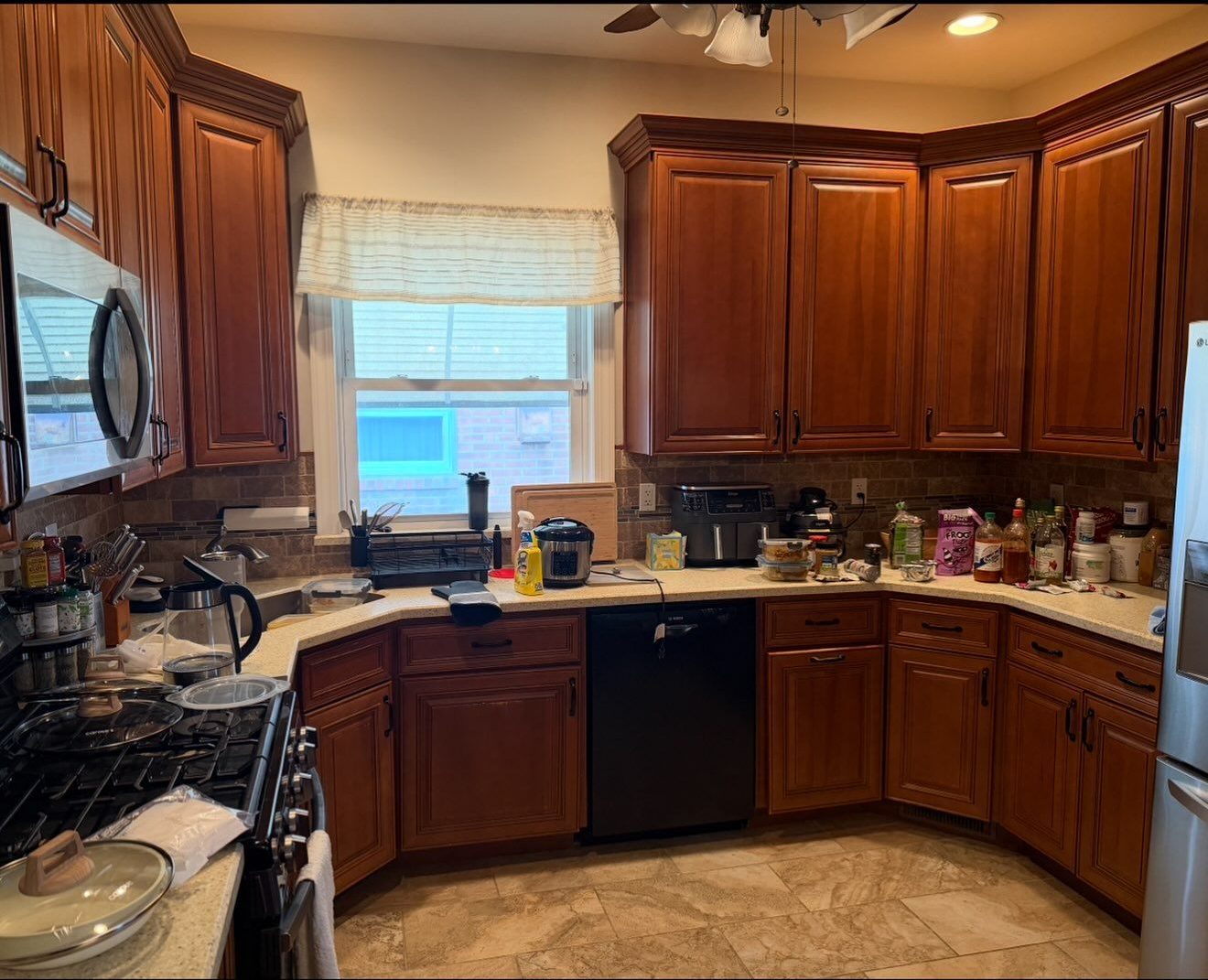kitchen with wood cabinets, before cleaning